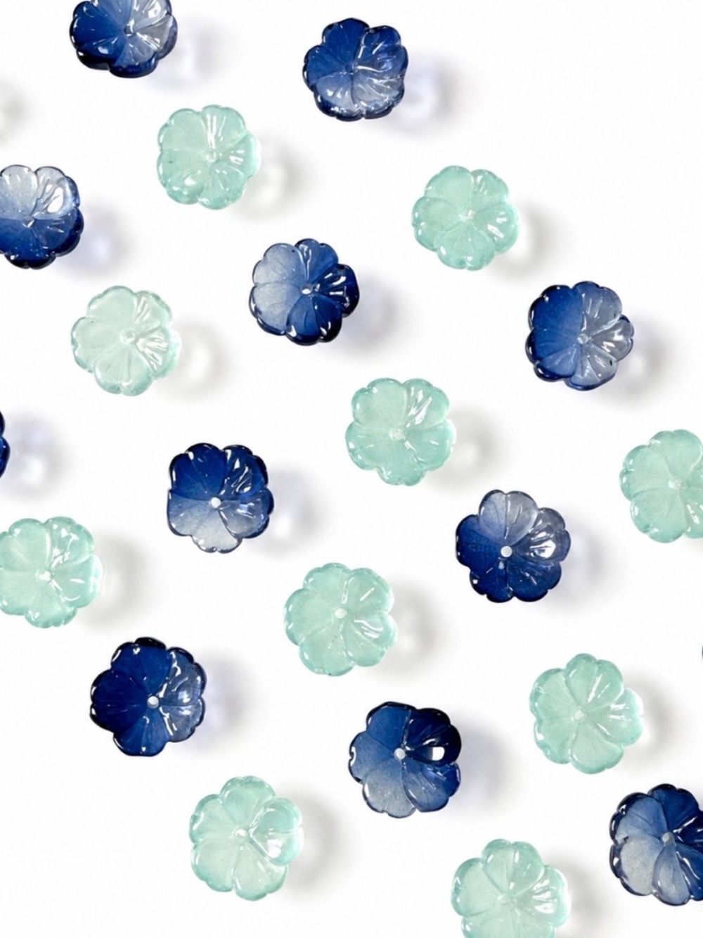 Beautiful translucent glass flower beads with detailed carved petals